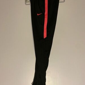 Nike Black and Pink Joggers with Bold Stripe